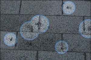 Hail strikes on a roof in Lakewood, CO.